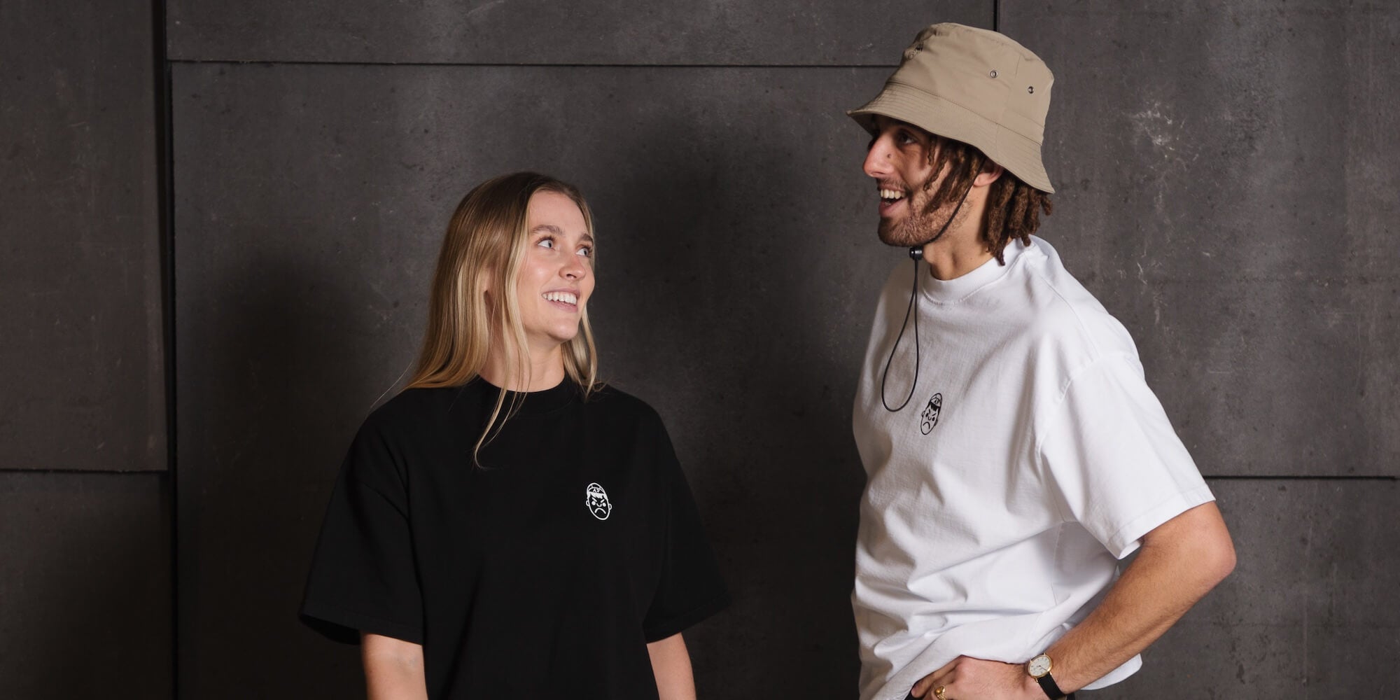 A man and woman smiling whilst wearing Angry Pablo Heavy Oversized T-shirts