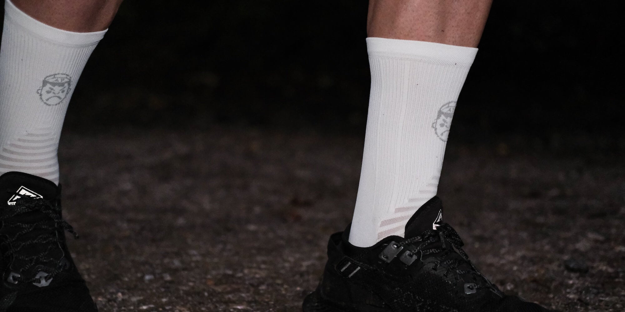 A close up of the Angry Pablo white running socks